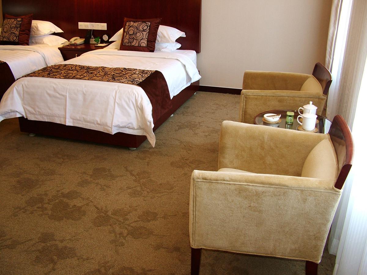 Fuxing Oriental Boutique Hotel Чифын Номер фото